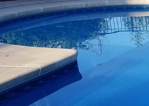 Concrete coping on a vinyl liner pool