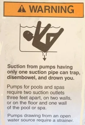 old pool pump entrapment warning tag