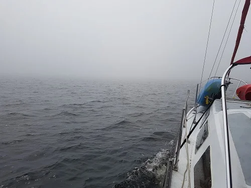 sailboat in the fog