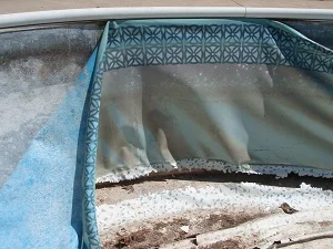 pool liner cut along bottom of wall